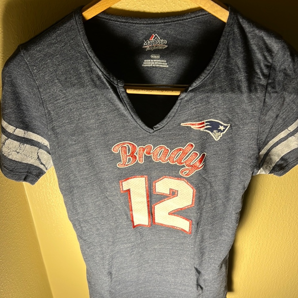 NFL Majestic Women’s Brady 12 Patriots Glitter Lettering V Neck Tee Color Blue
